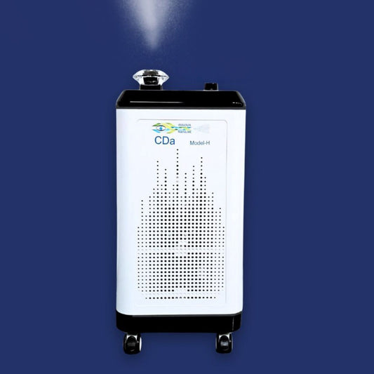 White CDA Model H device emitting mist on a blue background